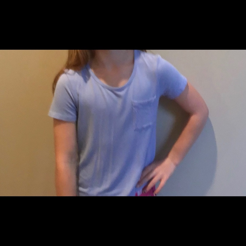 Light blue shirt with pocket.